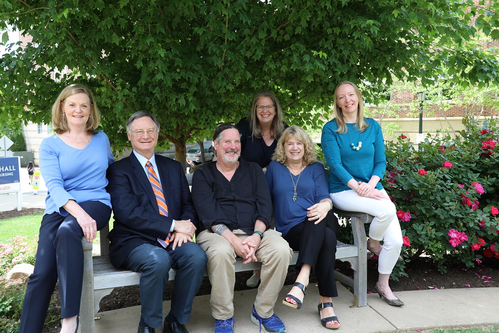 UVA Compassionate Care Initiative (CCI) team members Lili Powell, Richard Westphal, Jonathan Bartels, Julie Haizlip, Natalie May and Hannah Crosby pose for a group photo in May 2023.
