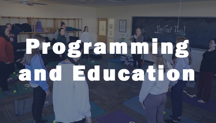 Nurses stretching with text overlay of 'Programming and Education'